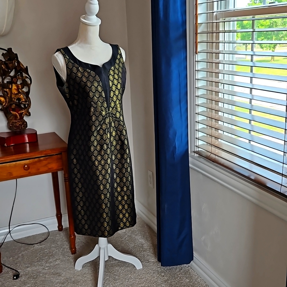 Two pieces dress, jacket and midi dress.Black and Gold.